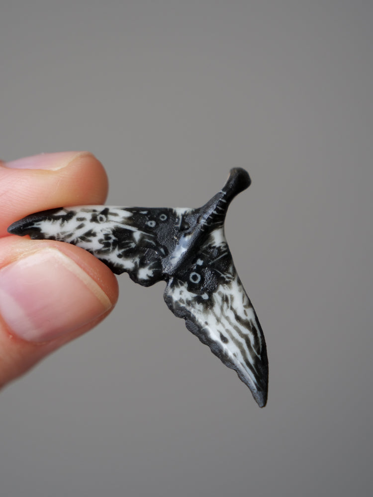 Porcelain whale tail pendants