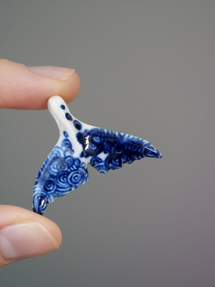 Porcelain whale tail pendants