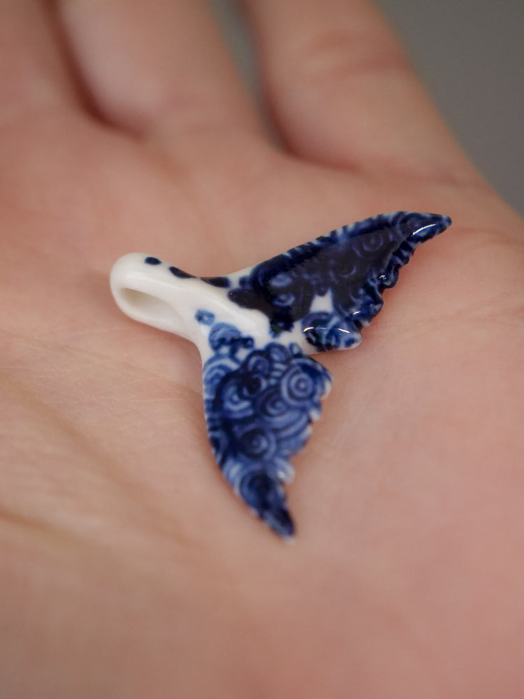 Porcelain whale tail pendants
