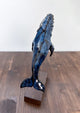 Humpback whale made of ceramics, on a wooden stand, beautiful glaring blue color, glossy