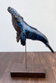 Humpback whale made of ceramics, on a wooden stand, beautiful glaring blue color, glossy