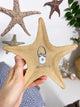 Starfish family made of ceramics mounted on wall, seaside creatures, coastal style stars