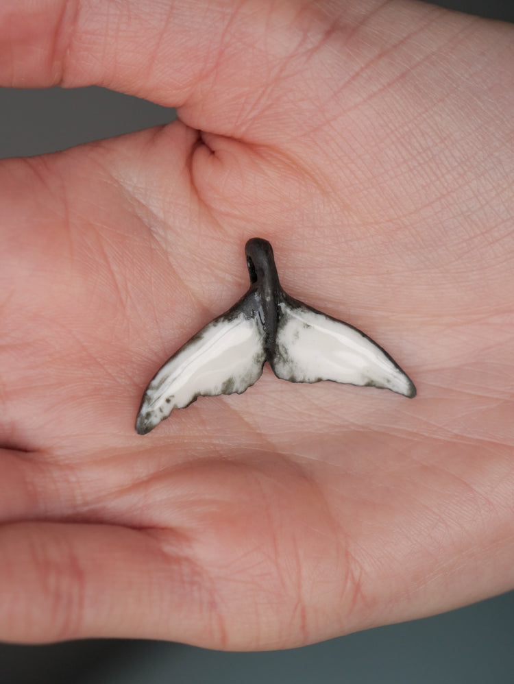 Whale tail pendants