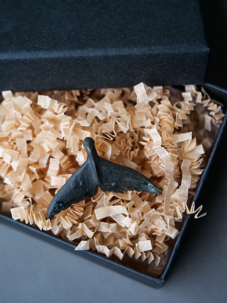 Whale tail pendants