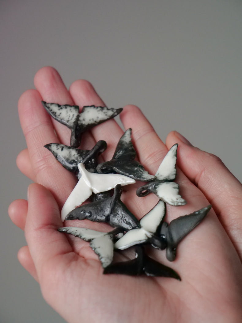 Whale tail pendants